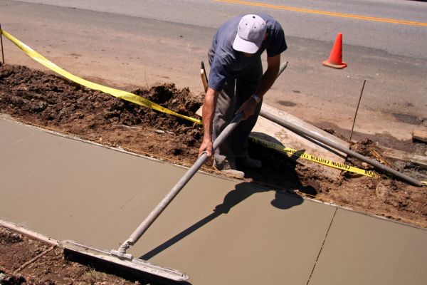 Cost of Sidewalk Building in Lansing